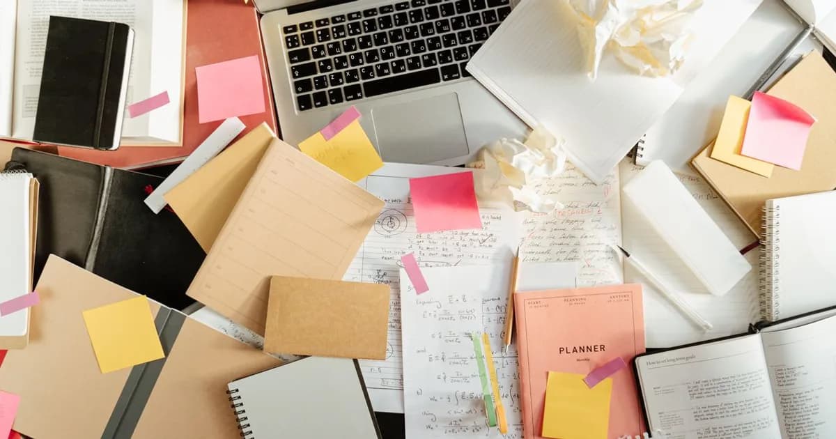 Close-up of handwritten study notes and index cards for active recall