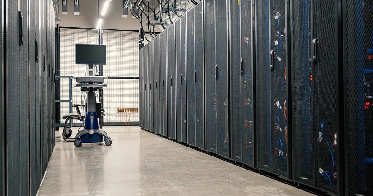 Rows of server racks in a modern data center aisle