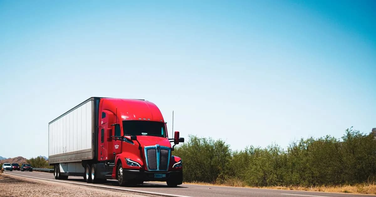 Semi truck on an open American highway at dusk