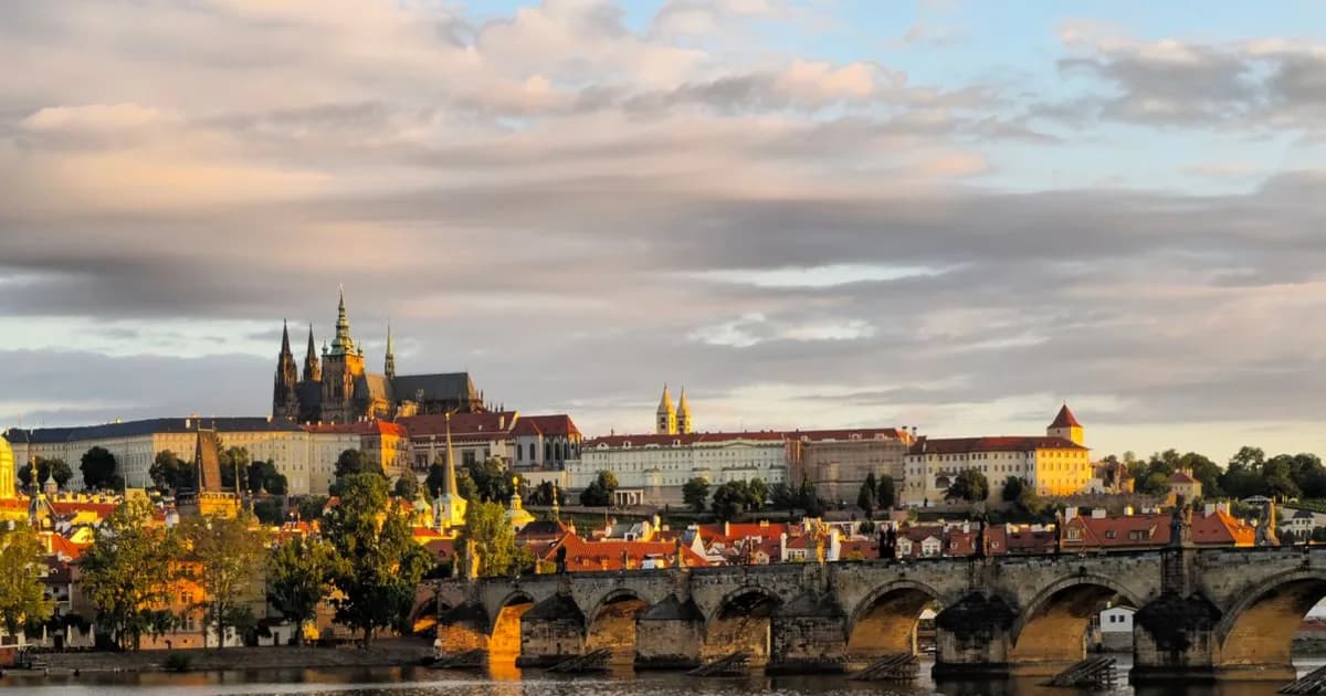 Prague Castle and Charles Bridge over the Vltava at dusk