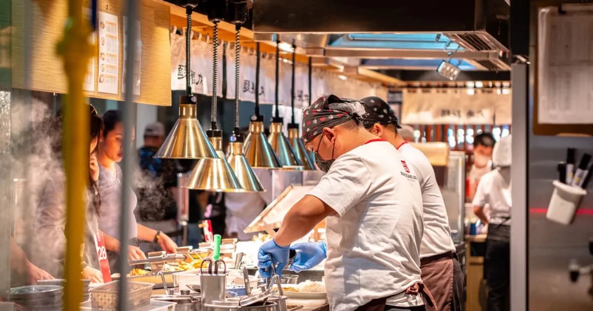 Busy commercial restaurant kitchen line during service