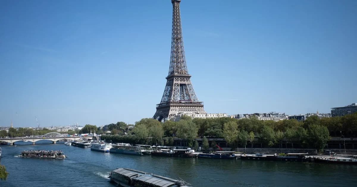 Paris skyline with Eiffel Tower and Seine River at dusk