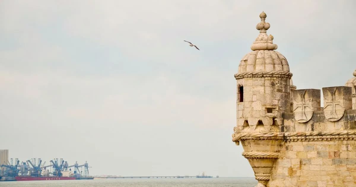 Lisbon Belém tower and Tagus river under blue sky