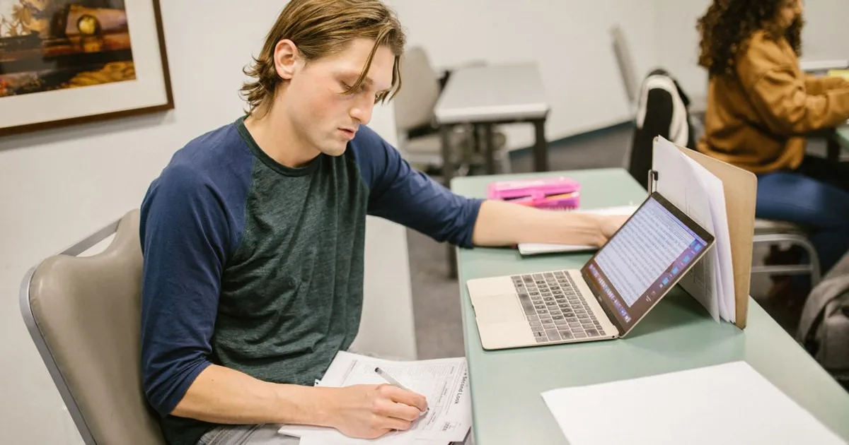 Person taking a timed online practice exam on a laptop at a desk