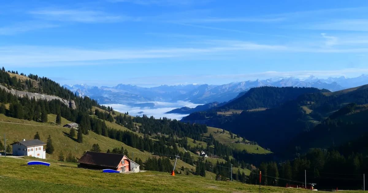 Swiss Alps village with mountains representing Switzerland